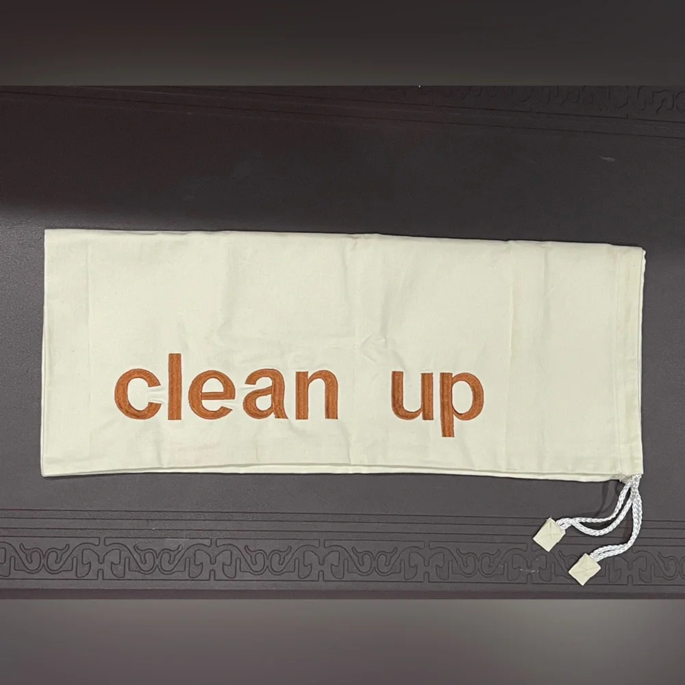 Cream Drawstring Canvas Bag with 'Clean Up' Embroidered Text
